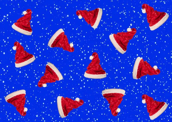 Festive Pattern Made Small Santa Claus Hats Blue Background Minimal — Stok fotoğraf