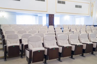 white leather chairs in the auditorium, conference room