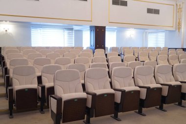 white leather chairs in the auditorium, conference room