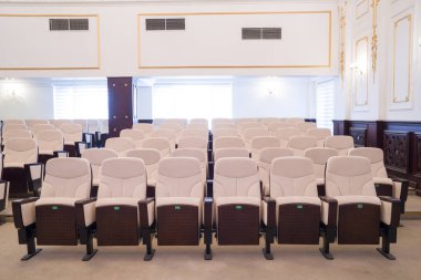 white leather chairs in the auditorium, conference room.