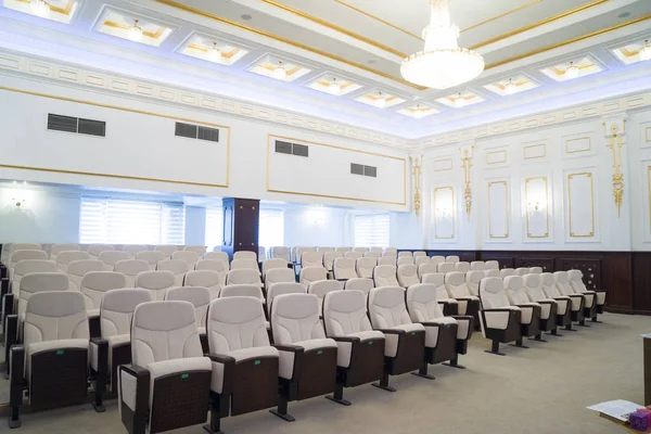 white leather chairs in the auditorium, conference room.