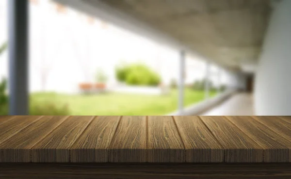 Wooden brown table top against the blurred corridor, passage and courtyard of the house .For product display montage or design is the key visual of the layout. — Stock Photo, Image