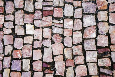 Asfalt daireler çiziyor. Bakış açısı. Asfalt taşı grisi. Arka plan için taş dokusu. Yakın plan. Soyut kaldırım taşı kaldırım arkaplanı.