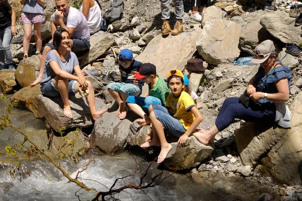 Qabala, Azerbayjan- 25 may 2017: Tourist standing on the shore of falling water of the most powerful waterfall