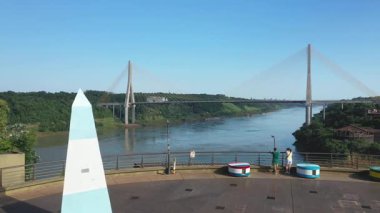Puerto Iguazu, Misiones, Argentina - May 18th, 2025: Tourists at the Three Borders Landmark.