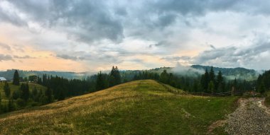 Sun and clouds - panoramic landscape of Carpathian mountains. View from Hoverla, Chornohora ridge clipart