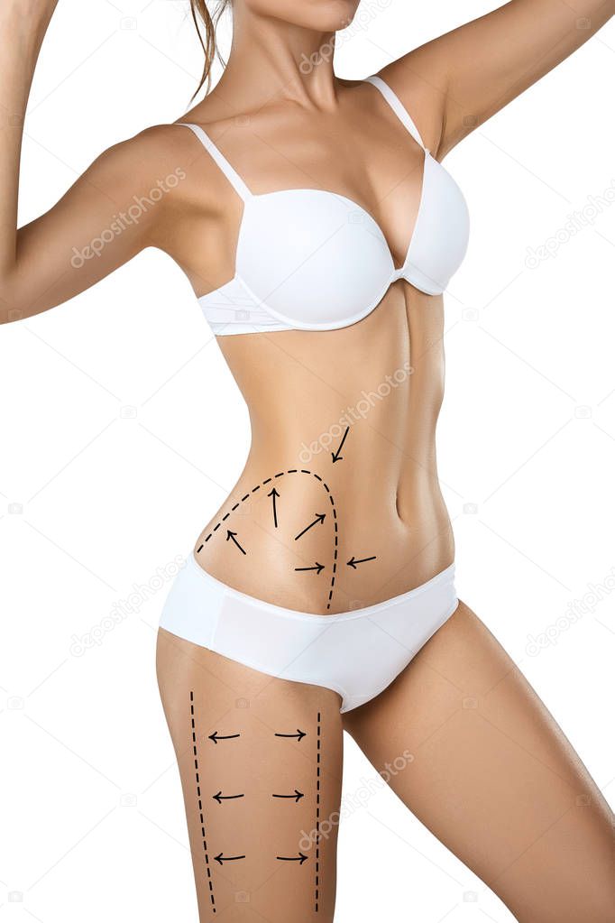 Studio HD capture of a unrecognizable young woman torso in underwear with the drawing arrows and medical marks. Fat lose, liposuction, cellulite removal and skin lifting concept.