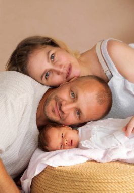 Family portrait of newborns first moments with parents. High quality photo