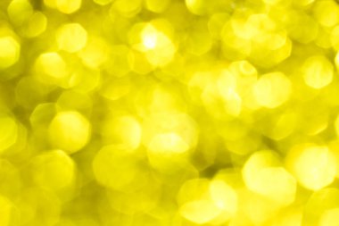 Bokeh ışıkları olan altın parıltılı şenlik arka planı. Yeni yıl, Noel tatili ve Sevgililer Günü için kutlama konsepti.