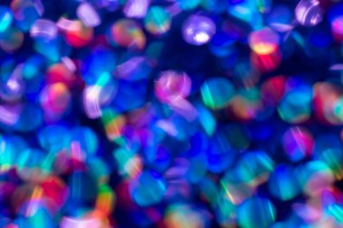 Gökkuşağı mavisi ışıltılı arka plan ve Bokeh ışıkları. Yeni yıl, Noel tatilleri ve yıldönümleri için kutlama konsepti.