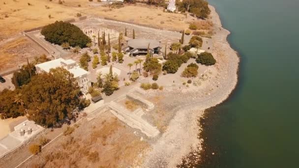Orthodox Church of the 12 apostles. Sea of Galilee. Capernaum. Aerial view — Stock Video