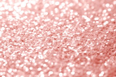Pembe parıltı dokusu. Şenlikli ışıl ışıl pullar arka planda yakın plan. Sevgililer günü, yeni yıl ve Noel tatilleri için parlak parlak duvar kağıtları..