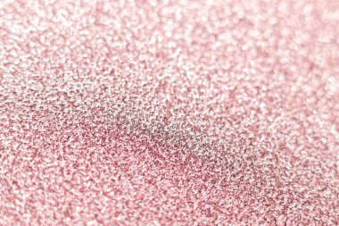 Pembe parıltı dokusu. Şenlikli ışıl ışıl pullar arka planda yakın plan. Sevgililer günü, yeni yıl ve Noel tatilleri için parlak parlak duvar kağıtları..