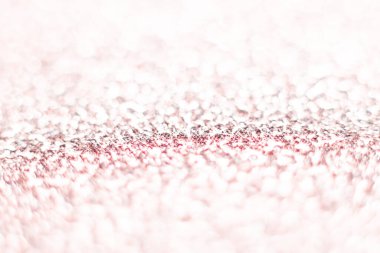 Pembe parıltı dokusu. Şenlikli ışıl ışıl pullar arka planda yakın plan. Sevgililer günü, yeni yıl ve Noel tatilleri için parlak parlak duvar kağıtları..