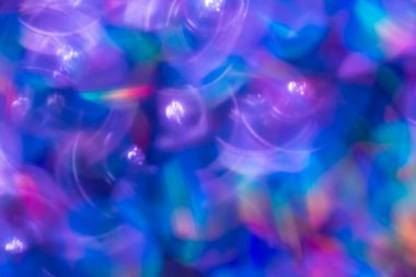 Gökkuşağı mavisi ışıltılı arka plan ve Bokeh ışıkları. Yeni yıl, Noel tatilleri ve yıldönümleri için kutlama konsepti.