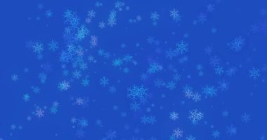 Kar taneleri olan bir Noel arkaplanı - mavi zemine düşen kar