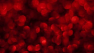 Kırmızı Mutlu Noeller sihirli Bokeh arka planı aydınlatıyor. Cazibeli Sevgililer Günü duvar kâğıdı. Yılbaşı, yıldönümü kutlamaları ve düğün törenleri için gösterişli full HD video..