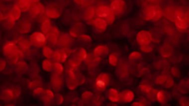 Kırmızı Mutlu Noeller sihirli Bokeh arka planı aydınlatıyor. Cazibeli Sevgililer Günü duvar kâğıdı. Yılbaşı, yıldönümü kutlamaları ve düğün törenleri için gösterişli full HD video..