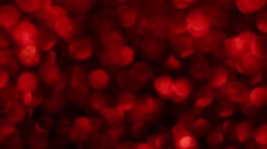 Kırmızı Mutlu Noeller sihirli Bokeh arka planı aydınlatıyor. Cazibeli Sevgililer Günü duvar kâğıdı. Yılbaşı, yıldönümü kutlamaları ve düğün törenleri için gösterişli full HD video..