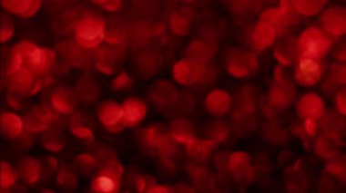 Kırmızı Mutlu Noeller sihirli Bokeh arka planı aydınlatıyor. Cazibeli Sevgililer Günü duvar kâğıdı. Yılbaşı, yıldönümü kutlamaları ve düğün törenleri için gösterişli full HD video..