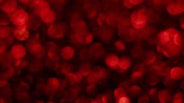 Kırmızı Mutlu Noeller sihirli Bokeh arka planı aydınlatıyor. Cazibeli Sevgililer Günü duvar kâğıdı. Yılbaşı, yıldönümü kutlamaları ve düğün törenleri için gösterişli full HD video..