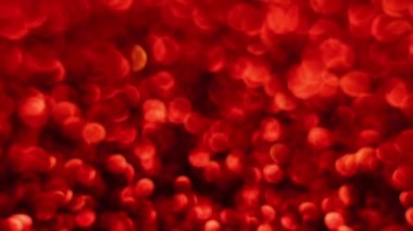 Kırmızı Mutlu Noeller sihirli Bokeh arka planı aydınlatıyor. Cazibeli Sevgililer Günü duvar kâğıdı. Yılbaşı, yıldönümü kutlamaları ve düğün törenleri için gösterişli full HD video..