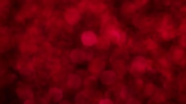 Kırmızı Mutlu Noeller sihirli Bokeh arka planı aydınlatıyor. Cazibeli Sevgililer Günü duvar kâğıdı. Yılbaşı, yıldönümü kutlamaları ve düğün törenleri için gösterişli full HD video..