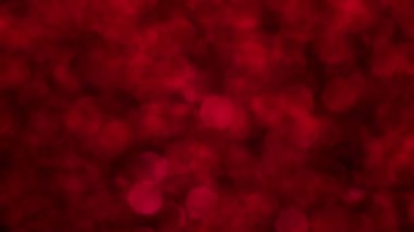 Kırmızı Mutlu Noeller sihirli Bokeh arka planı aydınlatıyor. Cazibeli Sevgililer Günü duvar kâğıdı. Yılbaşı, yıldönümü kutlamaları ve düğün törenleri için gösterişli full HD video..