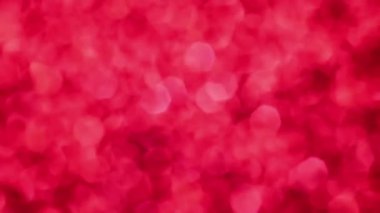 Kırmızı Mutlu Noeller sihirli Bokeh arka planı aydınlatıyor. Cazibeli Sevgililer Günü duvar kâğıdı. Yılbaşı, yıldönümü kutlamaları ve düğün törenleri için gösterişli full HD video..