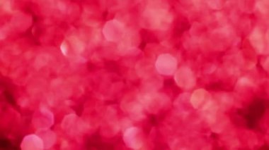 Kırmızı Mutlu Noeller sihirli Bokeh arka planı aydınlatıyor. Cazibeli Sevgililer Günü duvar kâğıdı. Yılbaşı, yıldönümü kutlamaları ve düğün törenleri için gösterişli full HD video..