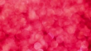 Kırmızı Mutlu Noeller sihirli Bokeh arka planı aydınlatıyor. Cazibeli Sevgililer Günü duvar kâğıdı. Yılbaşı, yıldönümü kutlamaları ve düğün törenleri için gösterişli full HD video..
