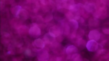 Violet Mutlu Noeller sihirli gece lambaları arka planı. Göz kamaştırıcı bir duvar kağıdı. Yılbaşı, yıldönümü kutlamaları ve düğün törenleri için gösterişli full HD video..