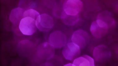 Violet Mutlu Noeller sihirli gece lambaları arka planı. Göz kamaştırıcı bir duvar kağıdı. Yılbaşı, yıldönümü kutlamaları ve düğün törenleri için gösterişli full HD video..