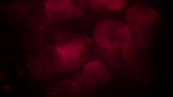 赤いメリークリスマス魔法のボケライトの背景 幸せなバレンタインデーの壁紙をグラマラス 新年のための豪華な光沢のあるフルHdビデオ 記念日のお祝いと結婚式 — ストック動画
