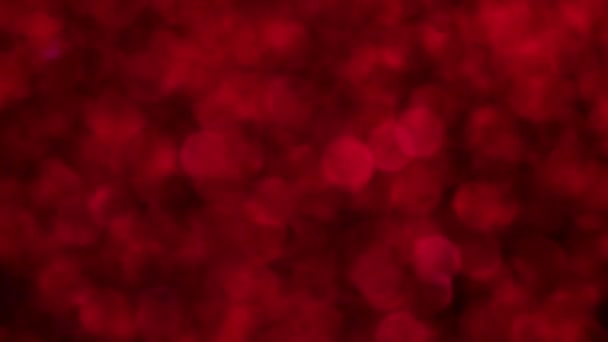 赤いメリークリスマス魔法のボケライトの背景 幸せなバレンタインデーの壁紙をグラマラス 新年のための豪華な光沢のあるフルHdビデオ 記念日のお祝いと結婚式 — ストック動画