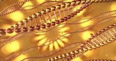 DNA moleküllerinin girdaplarıyla altın geometrik arka plan. Güzellik ve estetik cerrahi kliniği için dijital duvar kağıdı. Yenilik ve tıp konsepti. 3B görüntüleme döngüsü 4k