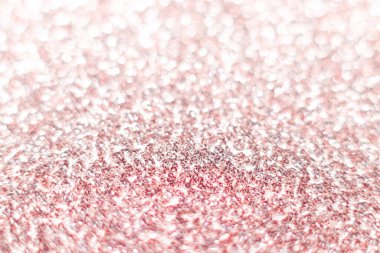 Pembe parıltı dokusu. Şenlikli ışıl ışıl pullar arka planda yakın plan. Sevgililer günü, yeni yıl ve Noel tatilleri için parlak parlak duvar kağıtları..