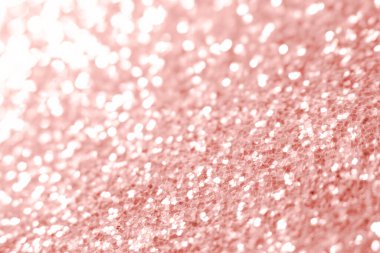 Pembe parıltı dokusu. Şenlikli ışıl ışıl pullar arka planda yakın plan. Sevgililer günü, yeni yıl ve Noel tatilleri için parlak parlak duvar kağıtları..