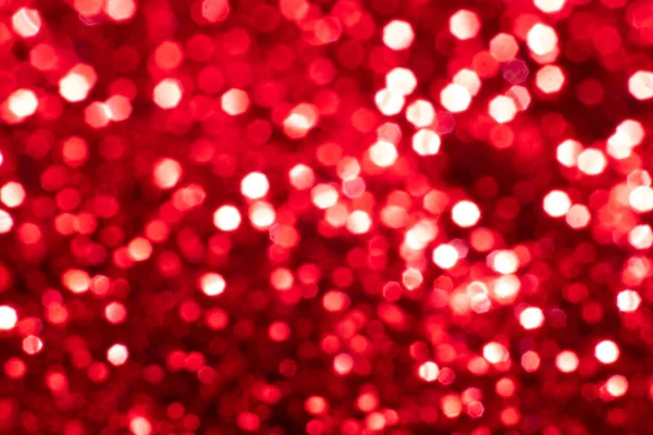 Fond rouge paillettes festives avec des lumières bokeh. Concept de célébration pour les vacances et l'anniversaire. — Photo