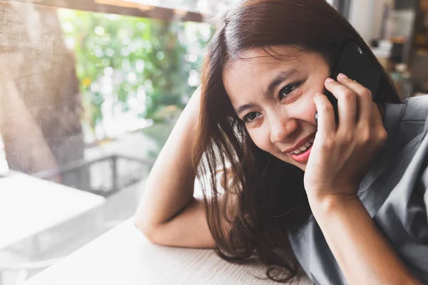 asian women talk to mobile phones