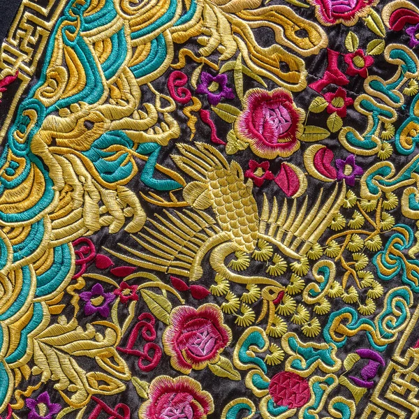 Close up of Chinese embroidery. This is an example of the craftsmanship of the Chinese for this embroidery. Everything is made by hand and a lot of gold color is used.