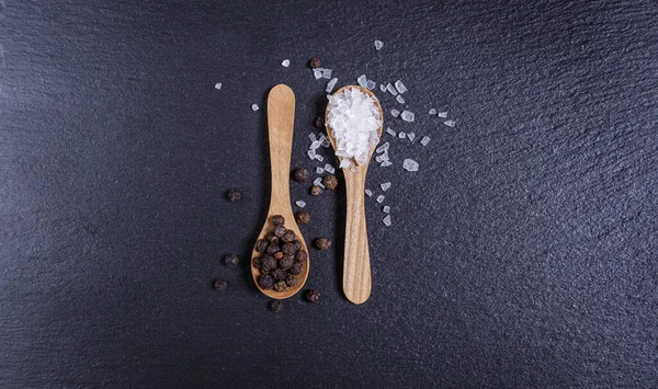 Salt Whole Black Pepper Wooden Spoon Dark Background Top View — Stock Photo, Image