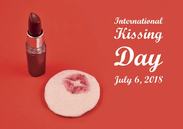 International Kissing Day illustration. Red lipstick on a red background. Lipstick kiss on a cotton pad. Kissing Day poster. Important day