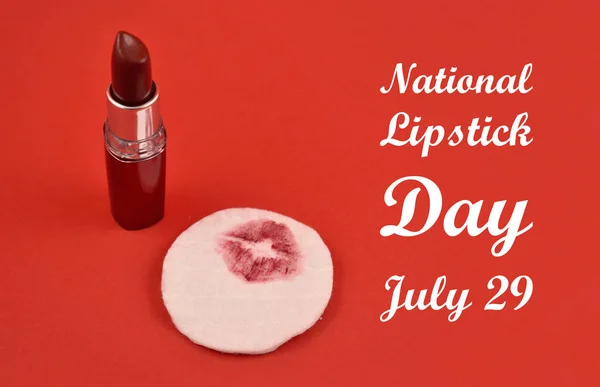 National Lipstick Day. Lipstick print. Red lipstick on a red background. Lipstick kiss on a cotton pad. Lipstick on a red background