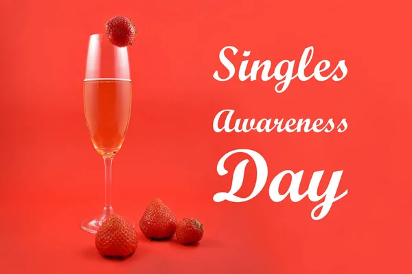 Singles Awareness Day images. Strawberries with champagne stock images. Glass of champagne with strawberries. February 15, Singles Awareness Day. American holiday. Important day