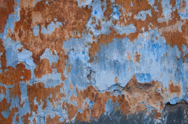 Eski duvar turuncu ve mavi boyalı kirli doku arkaplanı.