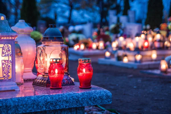 Colorful candles on the cemetery at All Saints Day. Poland