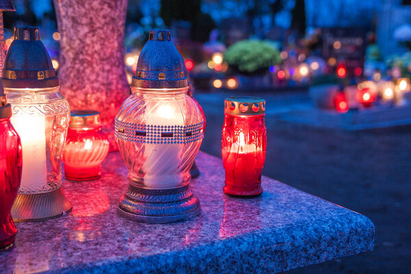 Colorful candles on the cemetery at All Saints Day. Poland