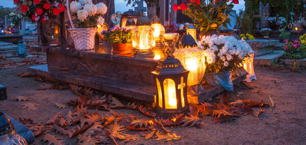 Colorful candles on the cemetery at All Saints Day. Poland