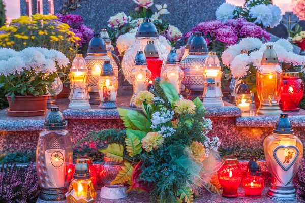 Burning candles on cemetery at All Saints Day in Poland